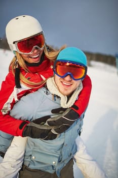 Affectionate couple in winter sportswear enjoying their vacation
