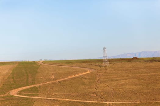 Dirt road dry season in rural farming mountain landscape