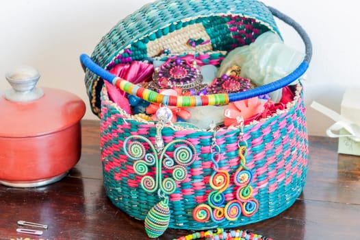 Earrings and necklace fabric and basket with colorful costume jewelery