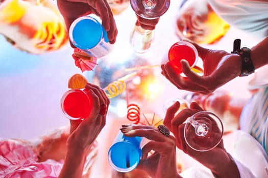 Cocktails held by friends at party