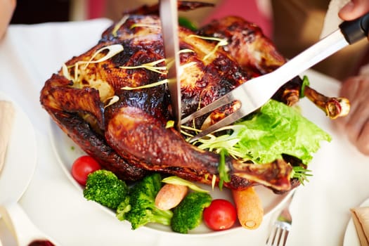 Homemade roasted turkey being cut