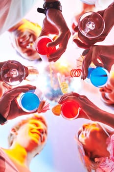 Cocktails in friends hands during toast