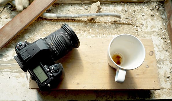 camera and coffee cup on site