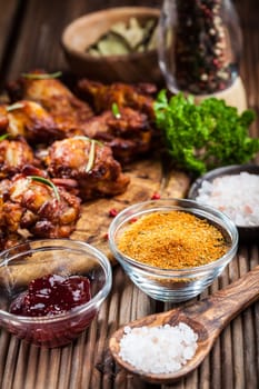 BBQ chicken wings with spices and dips