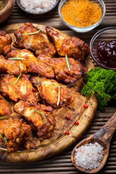 BBQ chicken wings with spices and dips