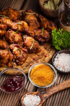 BBQ chicken wings with spices and dips