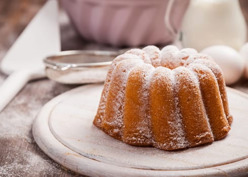 Homemade marble cake with baking utensils