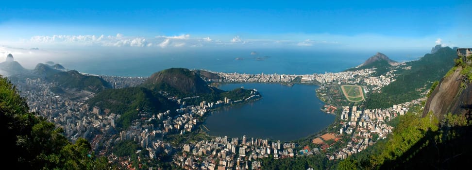 Panoramic view of Rio De Janeiro, sky, city and seashore view from Christ the Redeemer. Brazil landscape.