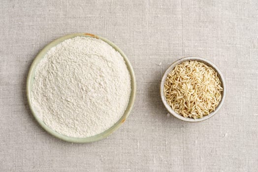 Whole grain rice and rice flour in small potted bowls