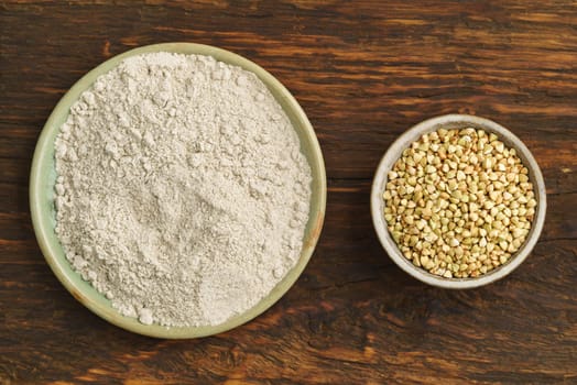 Buckwheat and buckwheat flour in small potted bowls