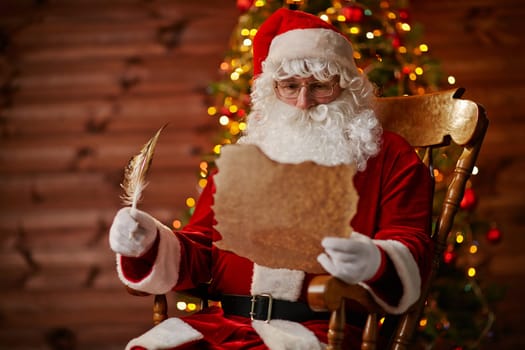Santa Claus reading Christmas letter