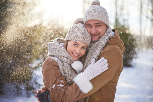Young dates in winterwear spending weekend outside