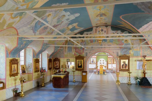 Halls for worship with pictures of biblical themes on the walls and ceilings of the church.