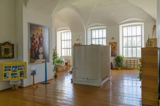 Large cylindrical container for holy water into the interior of the Orthodox Christian church