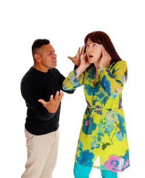 An Hispanic man yelling at his Caucasian wife, domestic.violence, isolated for white background..