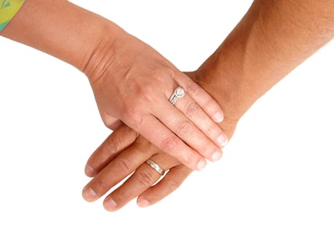 A closeup picture of the hand of a man and of a woman on top of the mans .hands, isolated for white background..