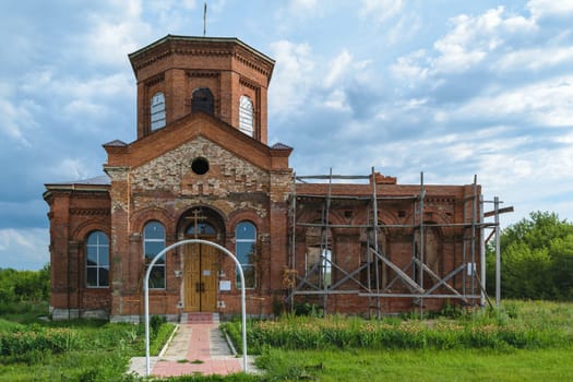 Ancient Orthodox church of bricks in the countryside, situated on the restoration.