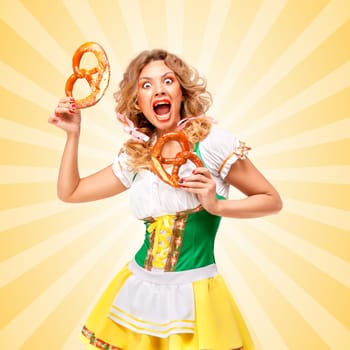 Beautiful scared sexy Oktoberfest woman wearing a traditional Bavarian dress dirndl holding two pretzels and screaming on colorful abstract cartoon style background.