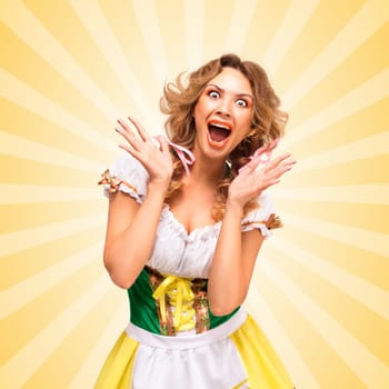 Beautiful sexy astonished Oktoberfest woman wearing a traditional Bavarian dress dirndl, showing happy facial emotions on colorful abstract cartoon style background.