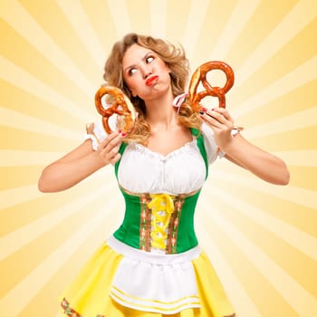 Beautiful sexy offended Oktoberfest woman wearing a traditional Bavarian dress dirndl holding two pretzels, puffing her cheeks and pouting on colorful abstract cartoon style background.