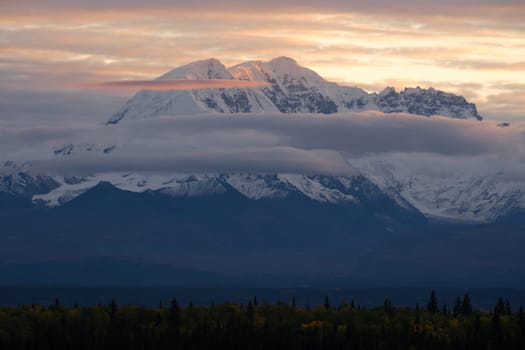 Sunrise happens behind Mt. Drum in remote Alaska