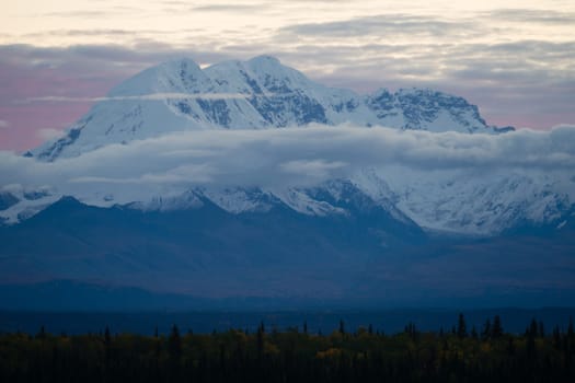 Sunrise happens behind Mt. Drum in remote Alaska