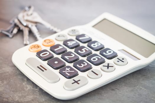 Calculator with keys on grey background, stock photo