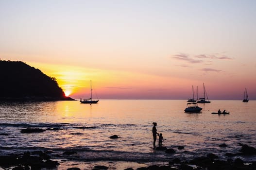 People in seascape with beautiful light from the sun and sky background, Phuket thailand