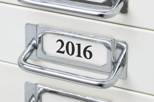 Drawer cabinet with the inscription 2016