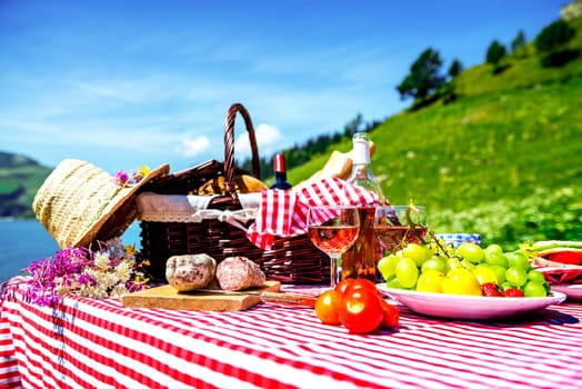 tasted picnic on the grass near a lake