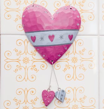 Heart with two large ceramic ceramic hearts on the wall