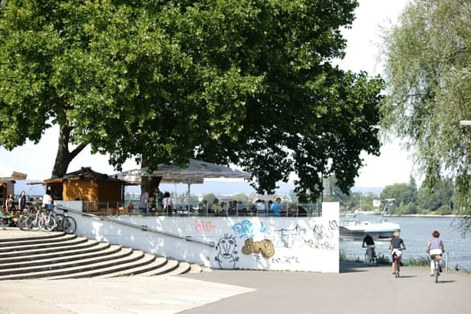 Mainz,Germany – August 22,2015: The Rheinufer Promenade on the terraces of Fort Malakoff with a beer garden and guests on August 22,2015 in Mainz.