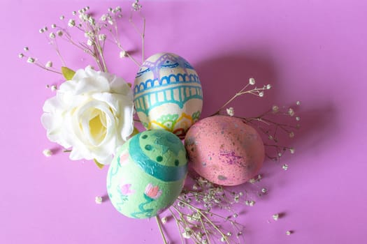 Easter eggs isolated on pastel shades background. Homemade painted Christian decoration. Real horizontal picture in vintage colour background