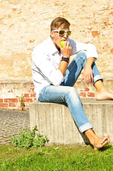 Good-looking young man posing in nature,stylish,modern
