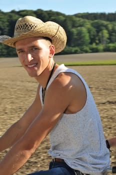 Good-looking young man posing in nature,stylish,modern