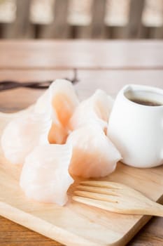 Chinese har gao dim sum dumplings on wooden plate, stock photo