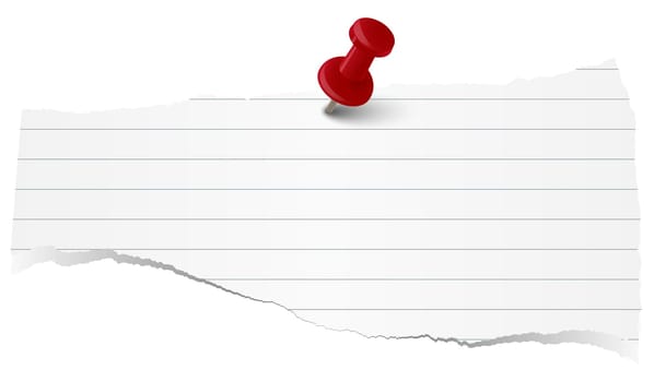 white colored lined scrap of paper with pin needle