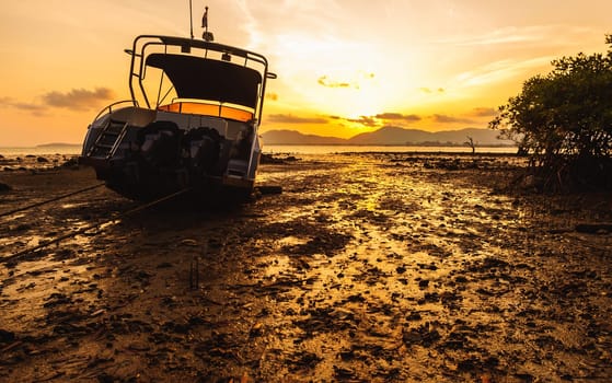 Boat side on the beach with color of sunset, Phuket thailand