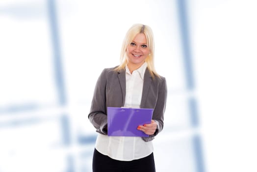 smiling blond young business woman with a clipboard