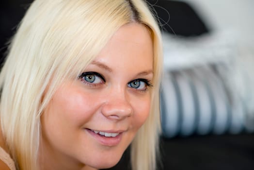 portrait of a smiling young blond woman