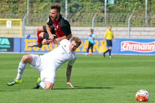 In this scene the Elversberg victory scorer,Kevin Maek (white jersey) cleared the Freiburger Fabian Schleusener,RL SW - 15/16 - SC Freiburg II vs SV Elversberg