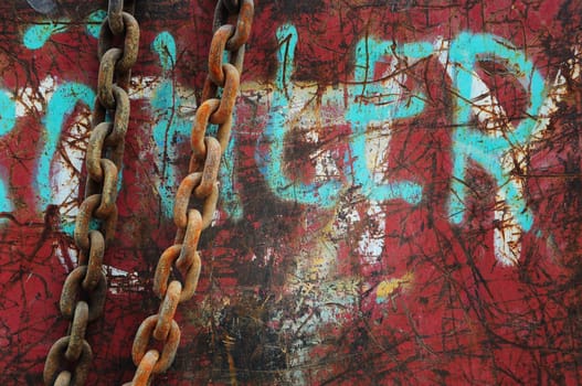 Red background on metal with chain of iron