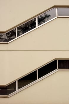 Two superimposed stairways with zigzag windows.