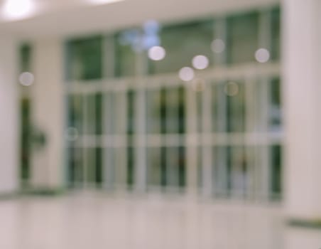 Defocused office, hospital or shopping mall building door background