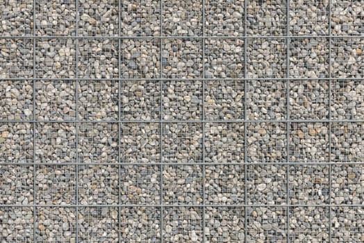 Background with a lot of pebble gravel stones texture filled in wire armature mesh grid