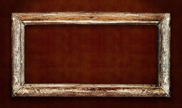 Old wood picture frame over vintage fabric background. Includes clipping path, so you can easily cut and place on a design.
