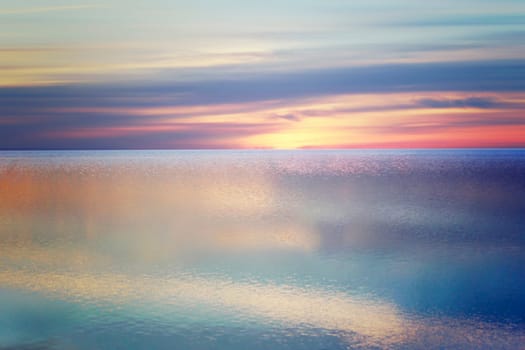 The North Sea rests quietly on the beach of St. Peter-Ording at sunset