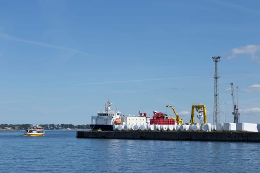 Cargo containers and tank tanks on a quay