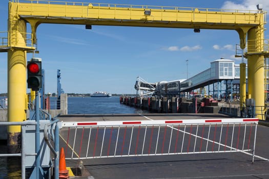 Barrier and traffic lights before the ferry access to Denmark