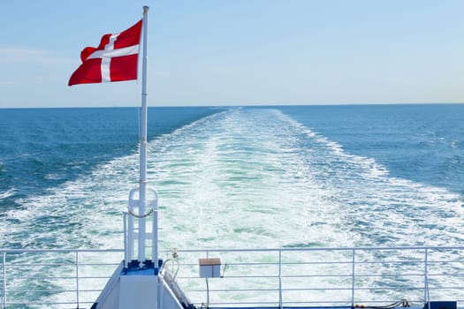 Danish flag at the back of a car ferry to Denmark